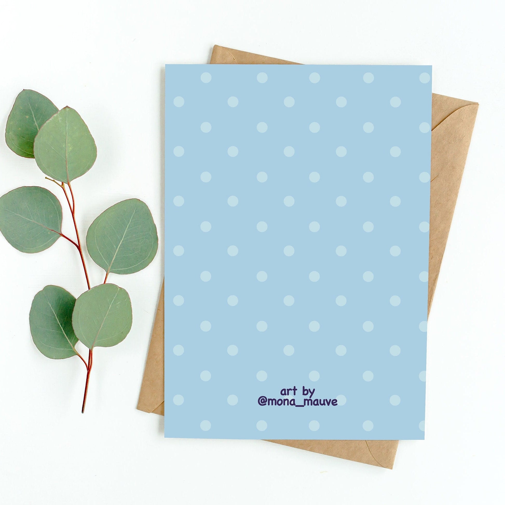 The back of the card. It reads: "Made by Mona Mauve. Thank you for supporting small artists!"