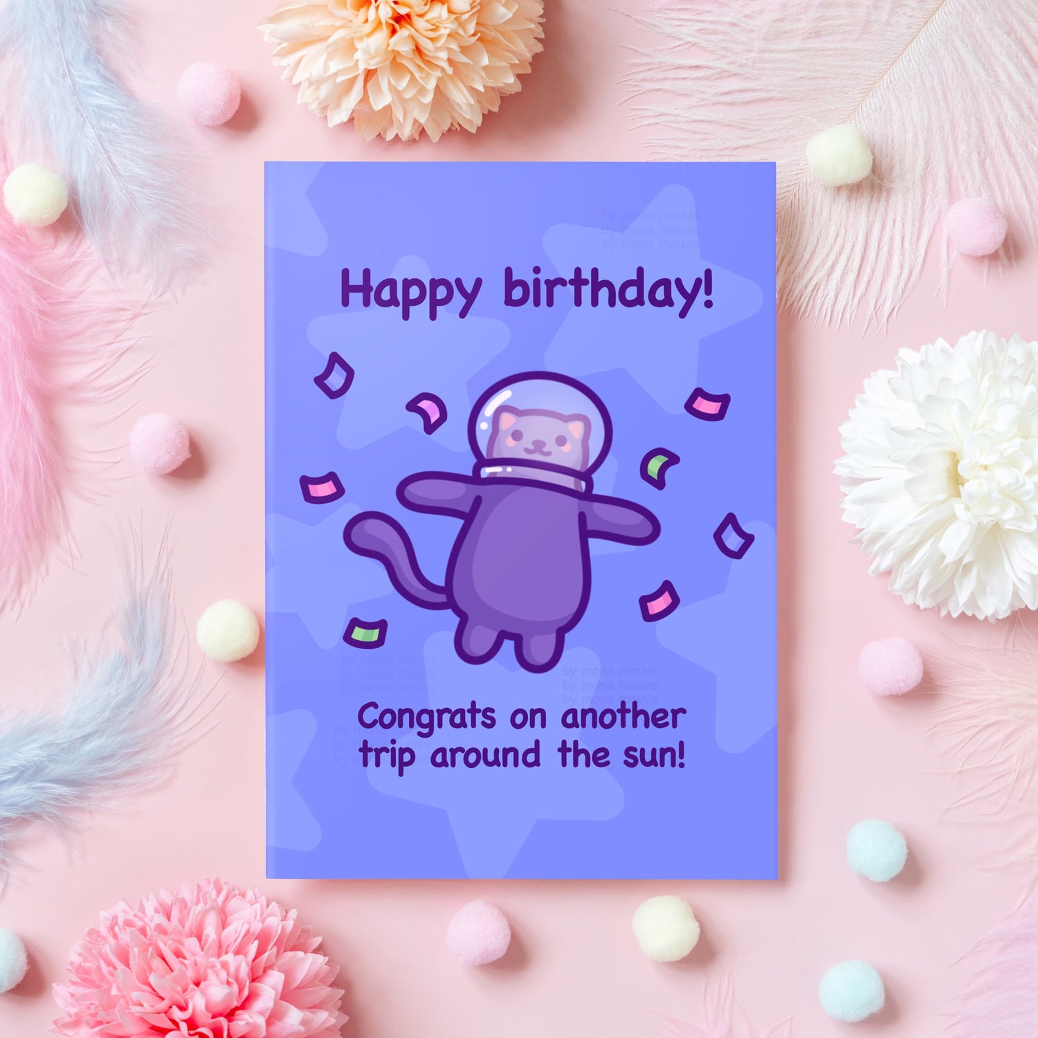 A birthday card with an astronaut cat that reads 'Happy birthday! Congrats on another trip around the sun!'