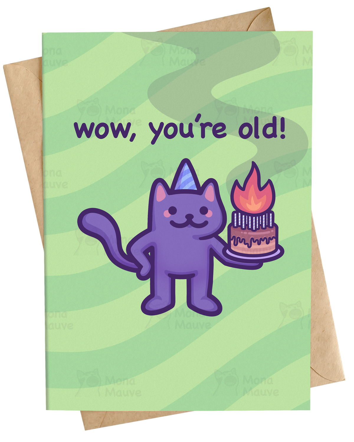 A greeting card with a light green striped background and the text 'wow, you're old!' above a cartoon purple cat wearing a party hat and holding a birthday cake. A kraft paper envelope is partially visible behind the card.