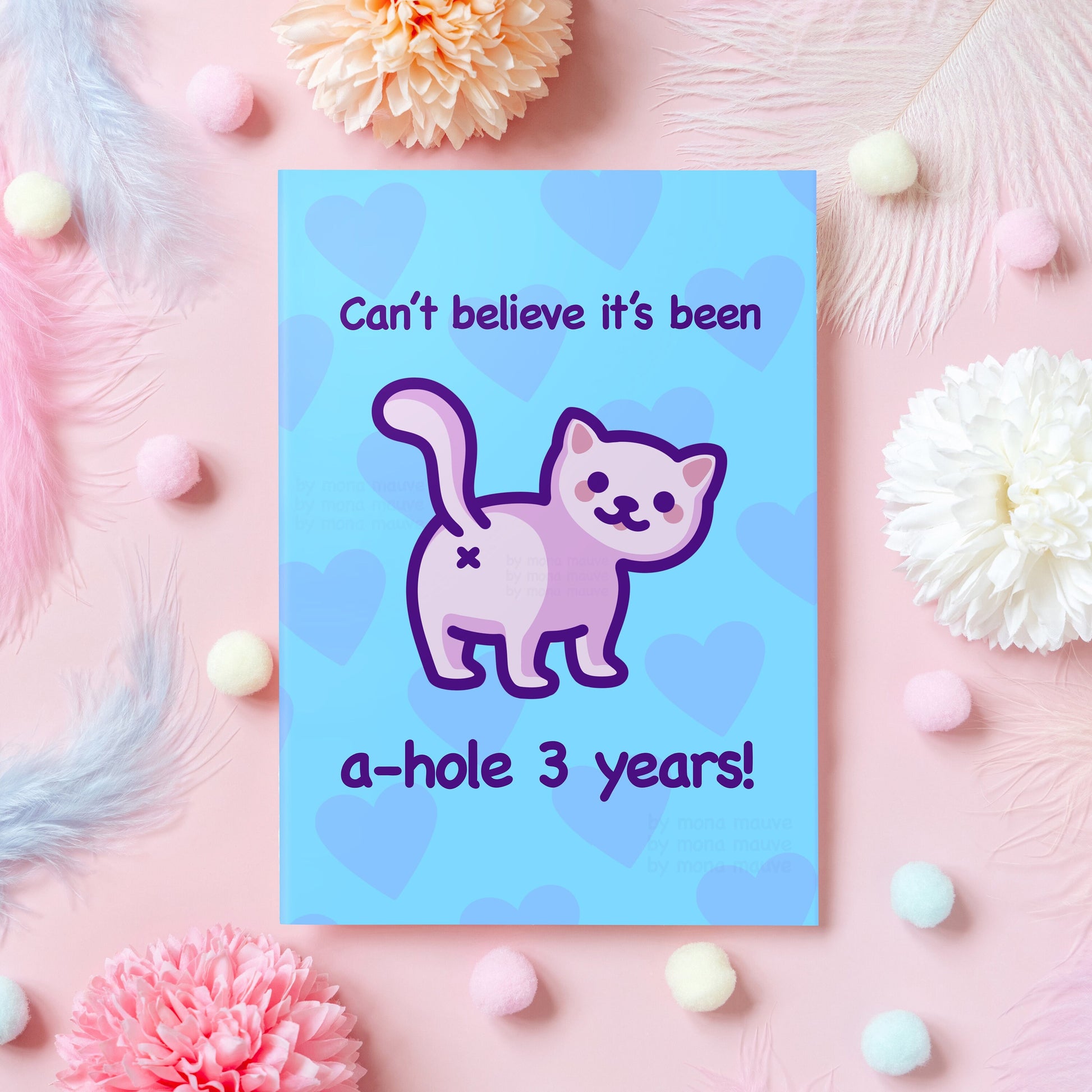 3 year anniversary greeting card with a funny illustration of a white cat with his butt facing the viewer. The card reads: "Can't believe it's been a-hole 3 years!"