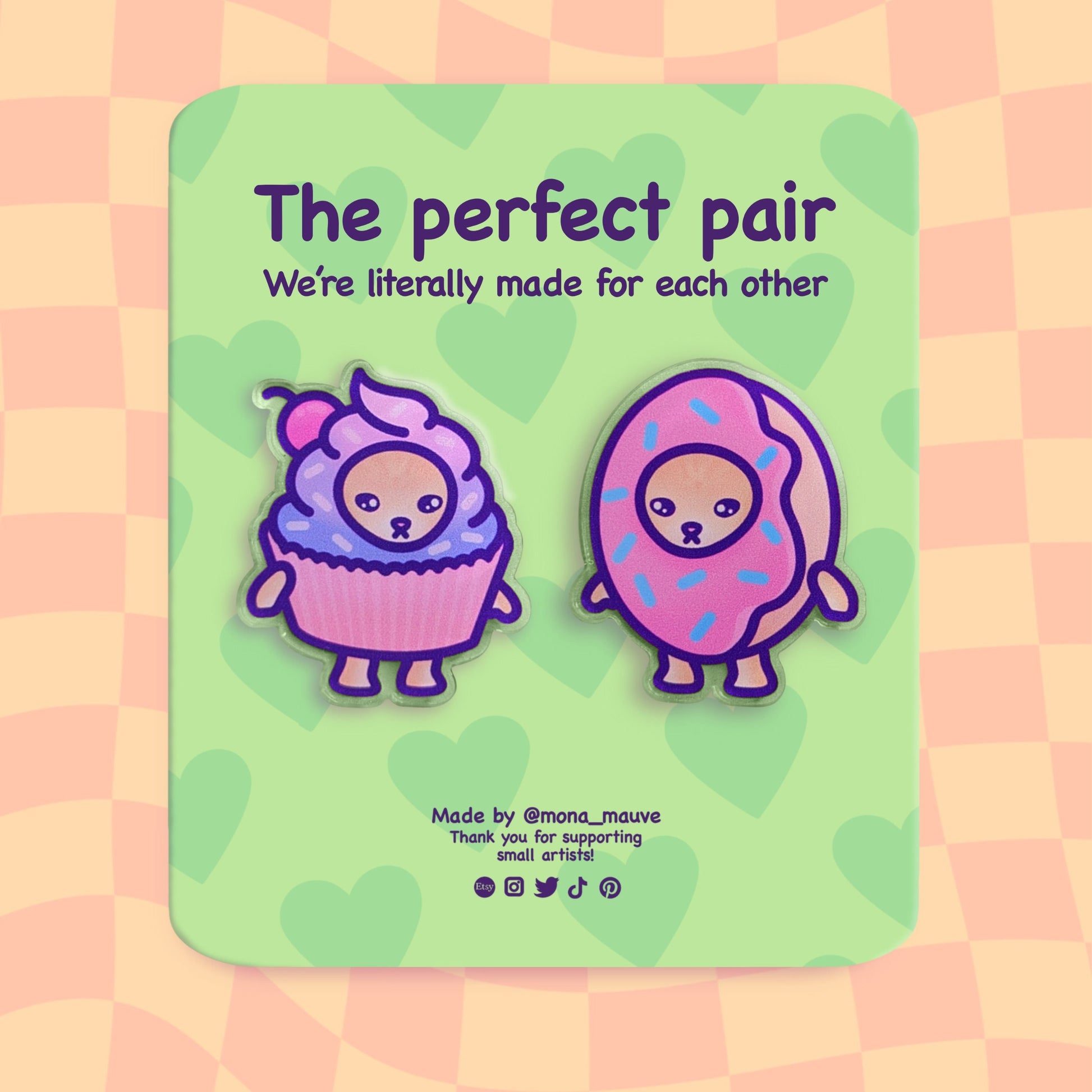  A set of two acrylic pins. One pin is a cat wearing a donut costume, the other - a cat wearing a cupcake costume. The backing card reads: "The perfect pair. We're literally made for each other"